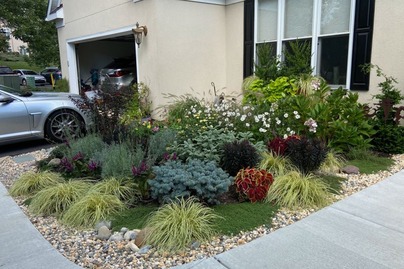 Stone replaces lawn for a colorful and whimsical edging